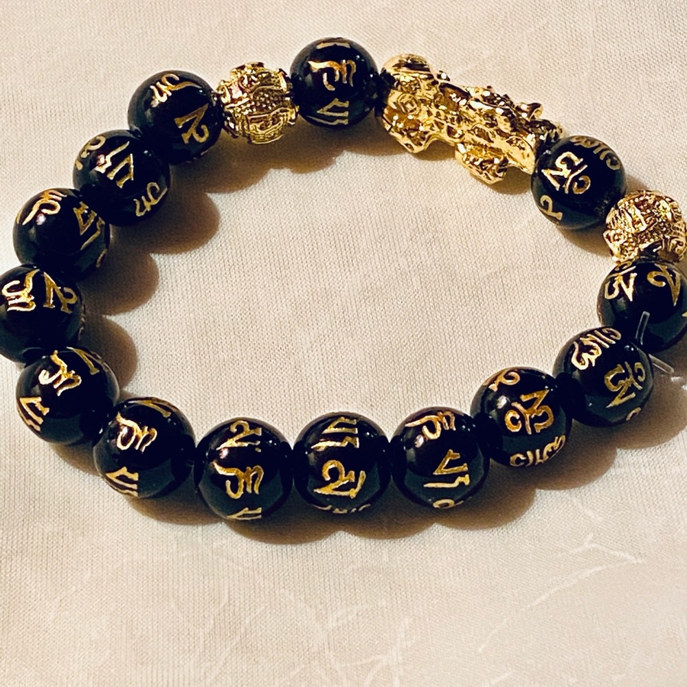 067) Unique gold-tone dragon with black beads